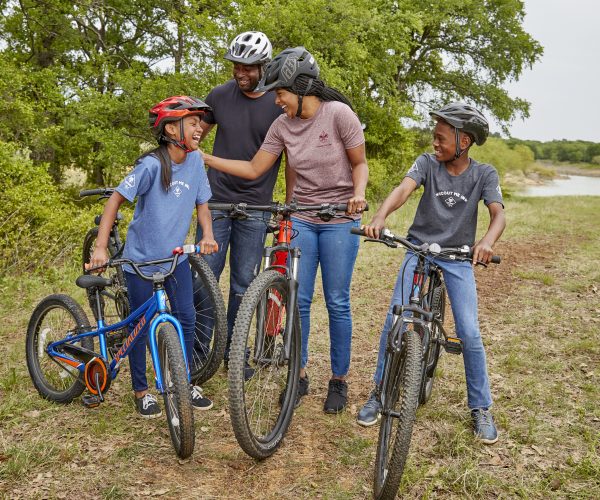 Cub Scouts riding bicycles in the park